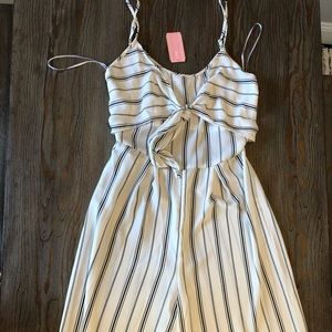 Black and white striped jumpsuit with tie in front